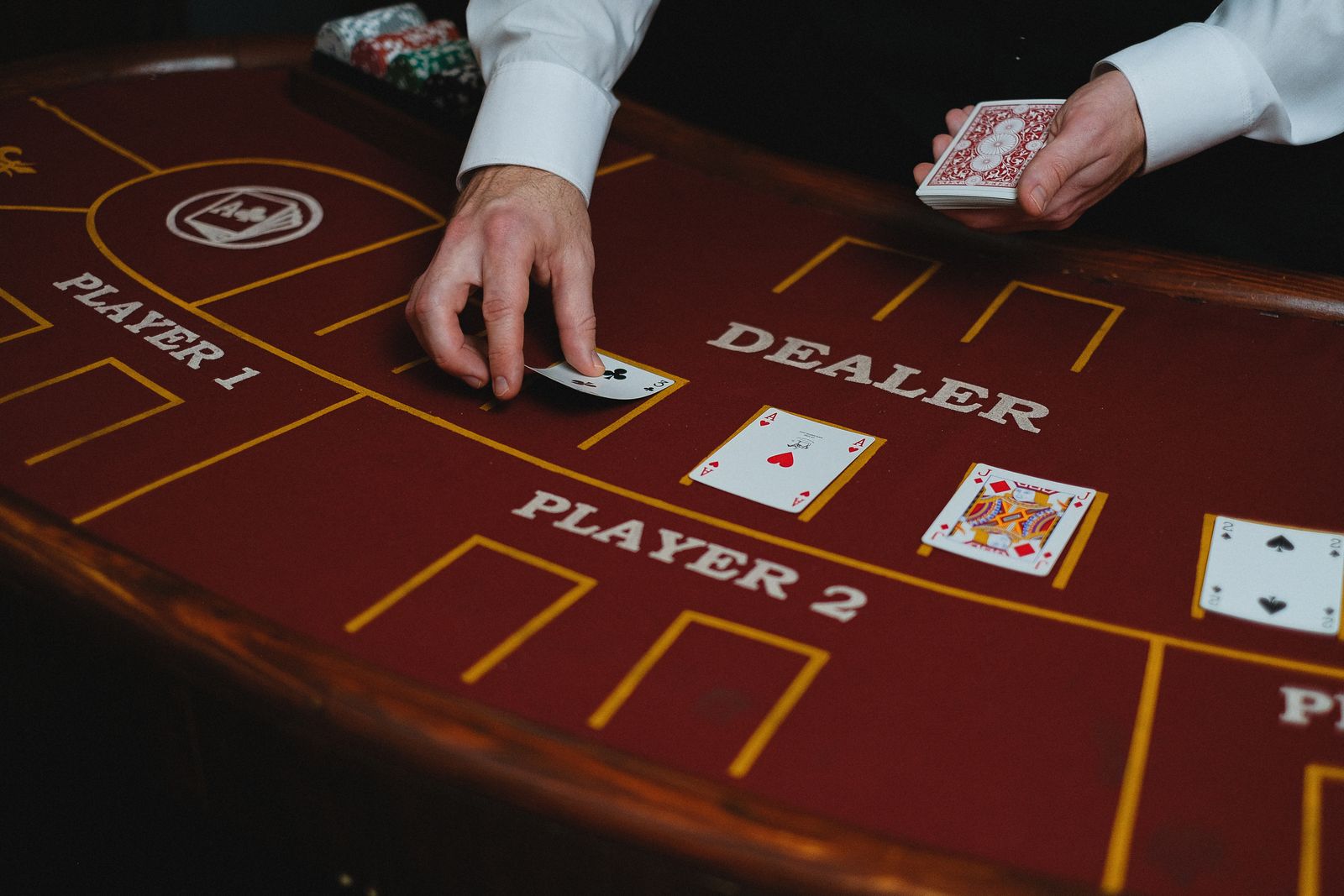 Croupier dealing cards on a blackjack table